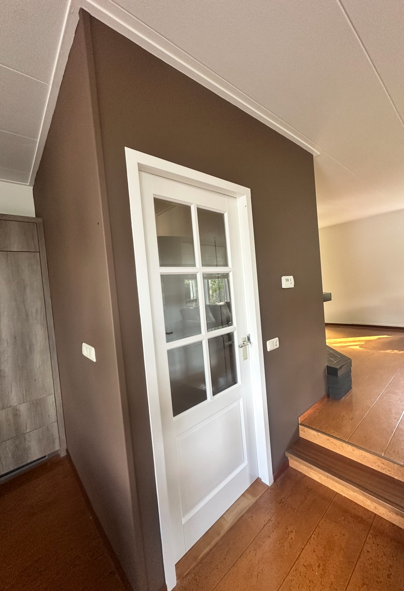 Schilderwerk woonkamer en gang Woubrugge